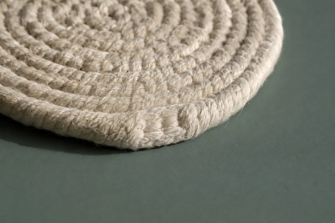 The visible flaw on ON-F-07: One coaster has a 10 mm flattened section on the outer round. The set spans 4 mm across the four pieces.