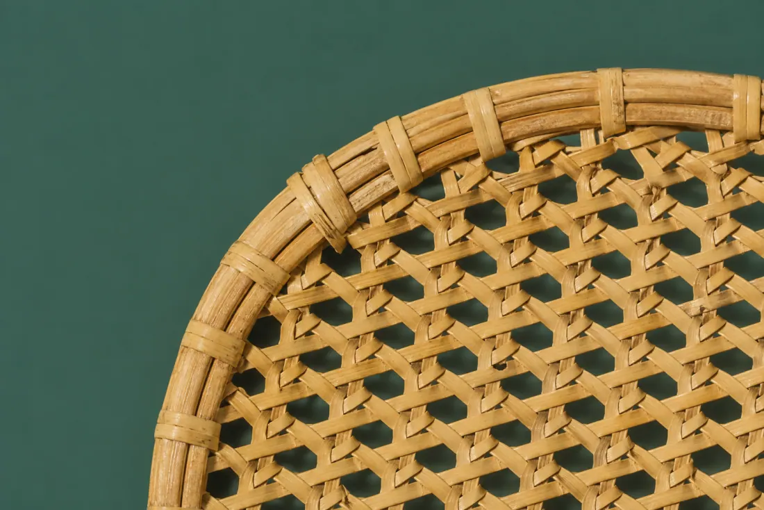 The visible flaw on ON-A-02: The rim wrap is 3 mm out of true over an 80 mm arc on the left side. One broken strand is spliced in on the outer wall, 90 mm above the base.