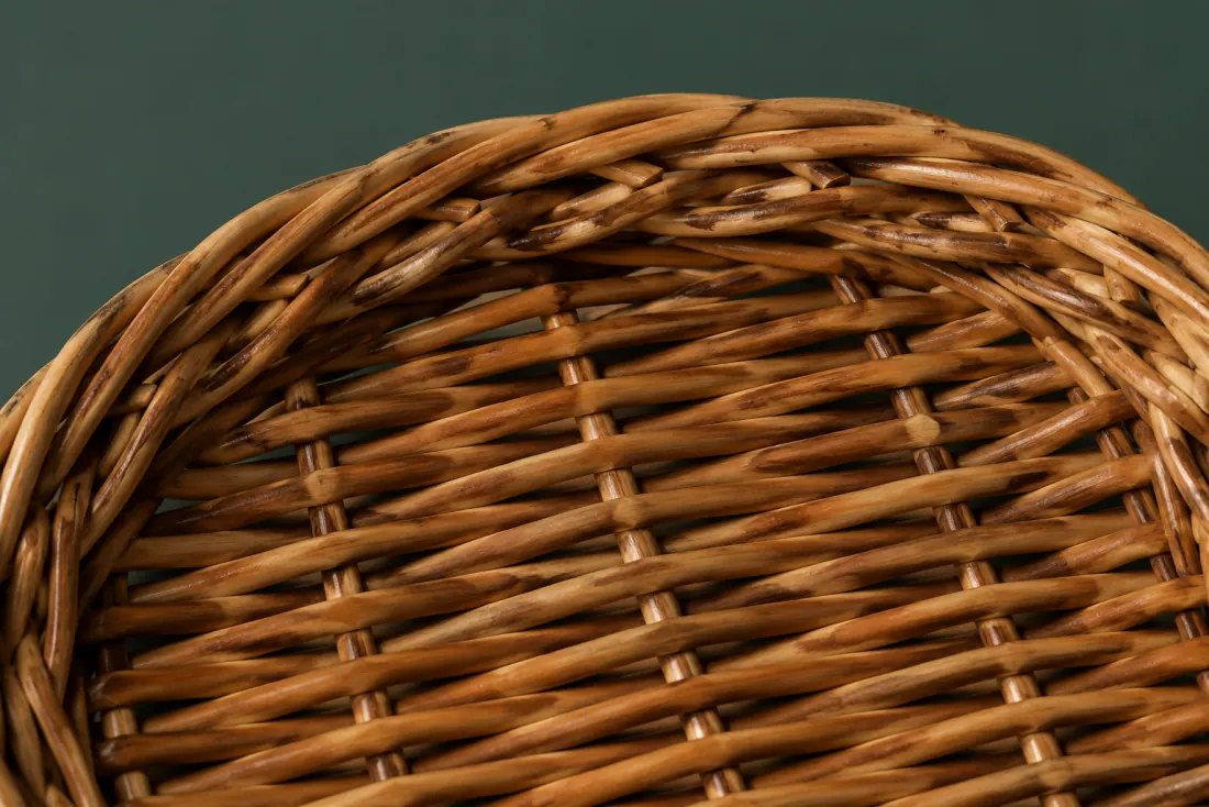 The weave and rim of ON-A-04 in close-up. Slath laid across the short axis; the randing closes at the left end of the long axis under the border.