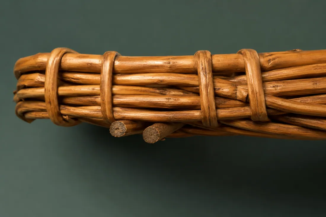 The visible flaw on ON-A-04: Two rod butts protrude 2–3 mm on the underside near the left end. A hairline crack runs 12 mm down the outside of one border rod.
