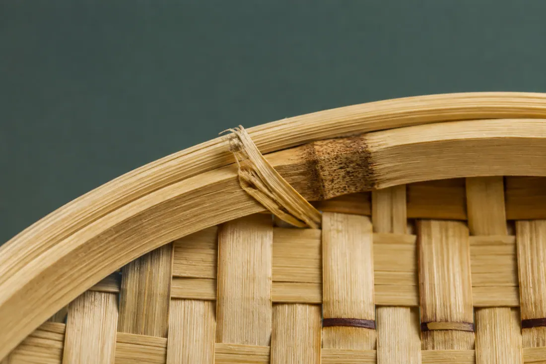 The visible flaw on ON-A-06: A 15 mm fibre burr lifts along one strip at the join, on the inside face. The mouth is 3 mm oval rather than round.