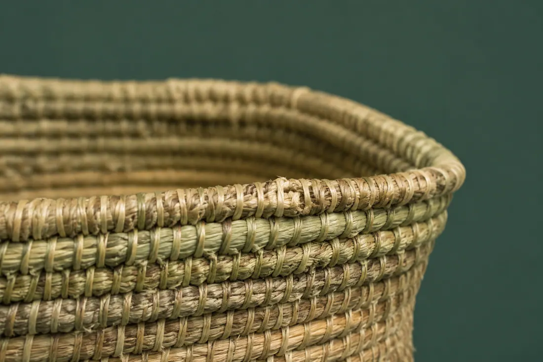 The visible flaw on ON-A-09: The rim is 4 mm out of level front to back. One stitch has pulled through the core near the handle-free front face.