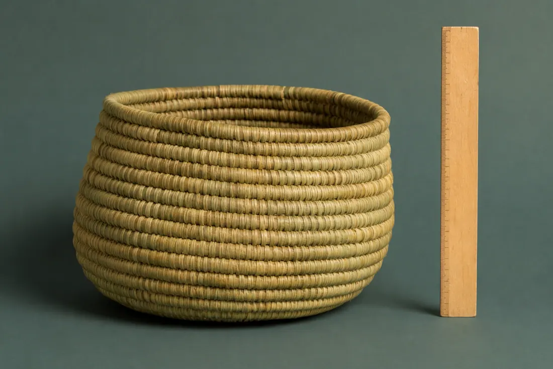 ON-A-09 photographed beside a ruler so you can judge its size against the published 305 mm.
