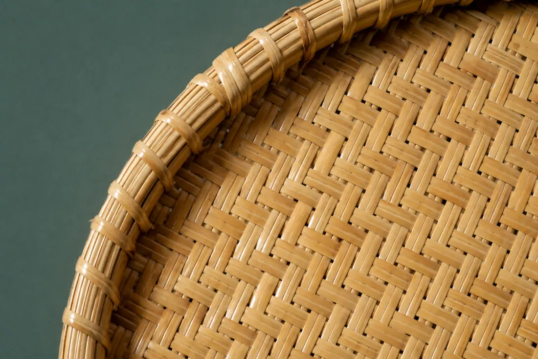 The weave and rim of ON-B-03 in close-up. Twelve-point cross; the pattern doubles at the outer third to hold the larger span.