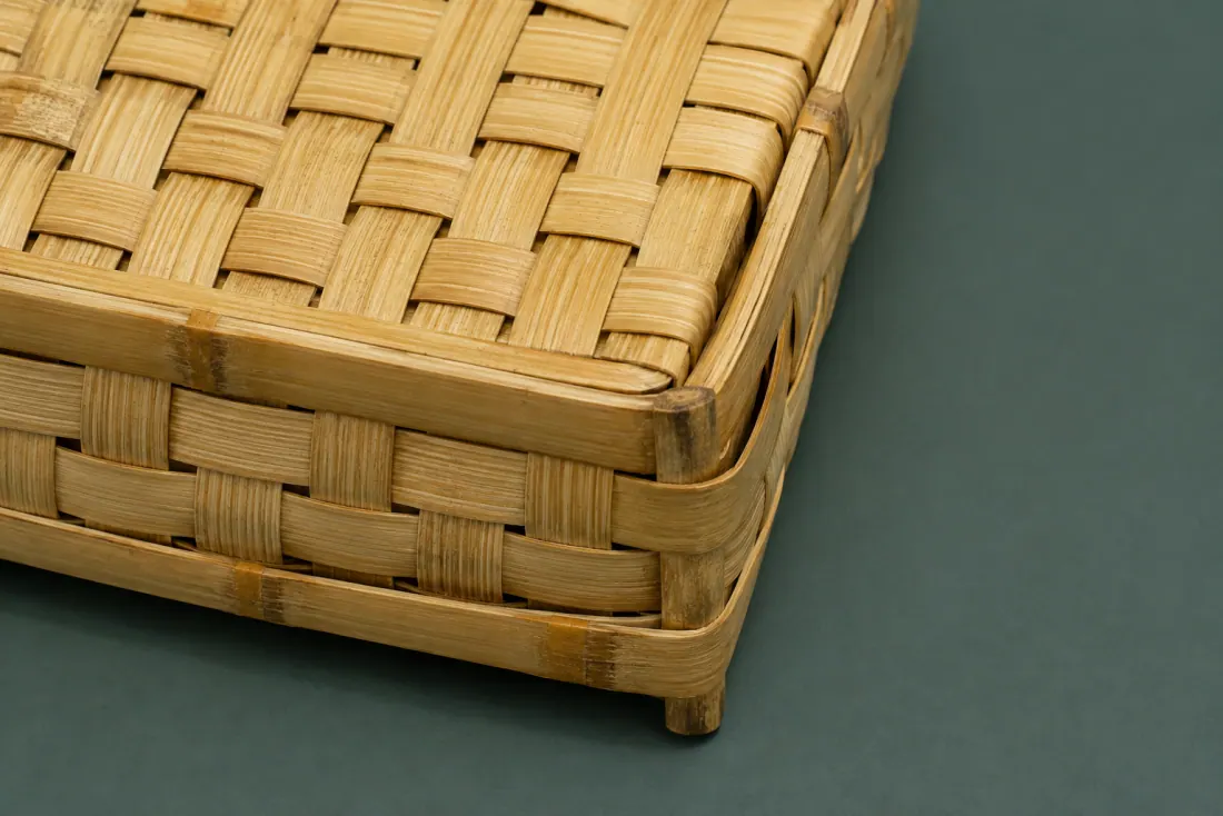 The visible flaw on ON-B-04: One corner of the frame is 3 mm out of square. A 10 mm burr lifts along one weft strip near the centre.