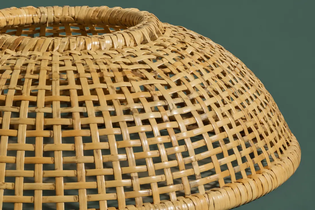 The weave and rim of ON-C-01 in close-up. Woven down from the top aperture ring; the closing stake meets the lower edge at five o’clock.