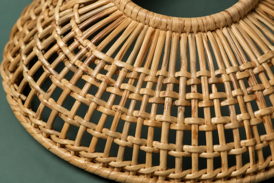 The weave and rim of ON-C-02 in close-up. Woven down from the top ring in the opposite hand to its pair; the closing stake sits at eleven o’clock.