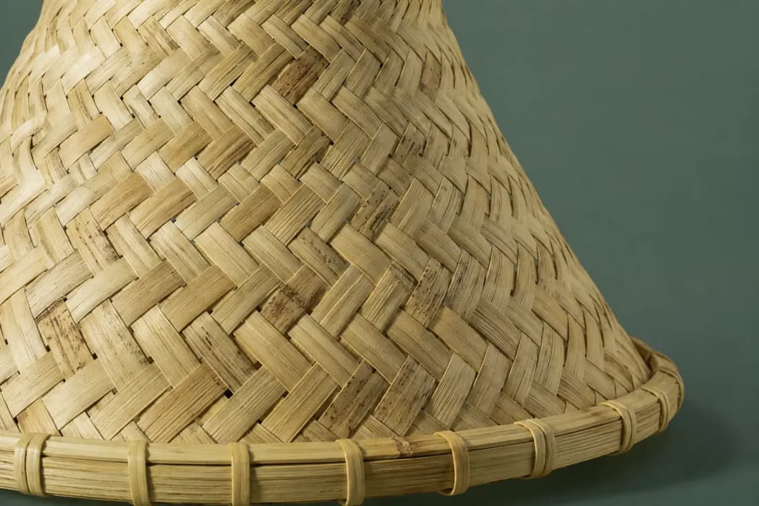 The weave and rim of ON-C-03 in close-up. Twill worked from the narrow top downward; the strips step once at 180 mm where lengths were joined.