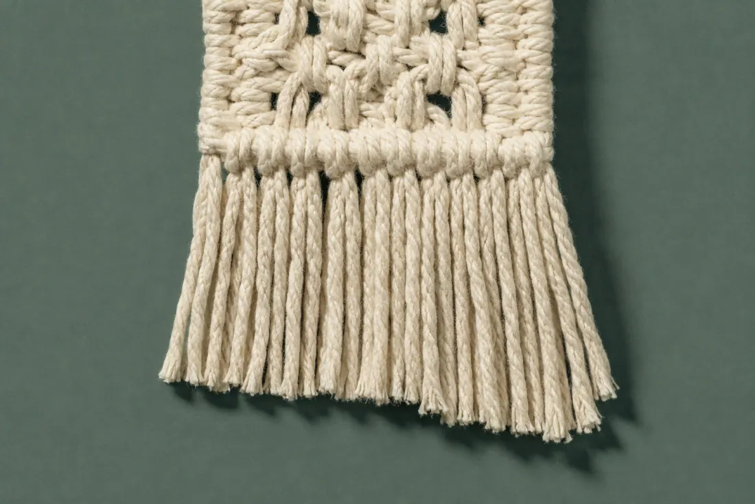 The visible flaw on ON-D-05: The fringe is 8 mm longer on the right than the left. One square knot in the second row sits 4 mm out of line.
